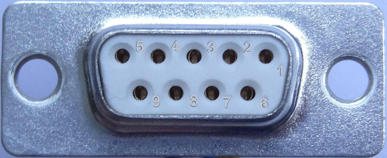 A DE-9 female D-sub connector face with numbered solder-cup positions
