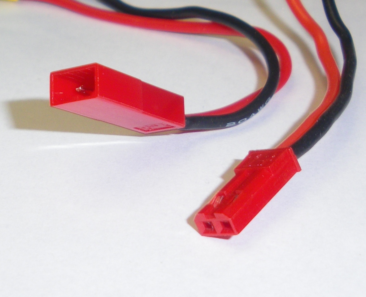 A mating pair of red JST RCY connectors on red and black wires